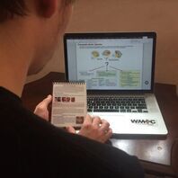 Student uses the WMTC handbook while taking the online Applied Anatomy and Physiology and Wilderness Medicine course.
