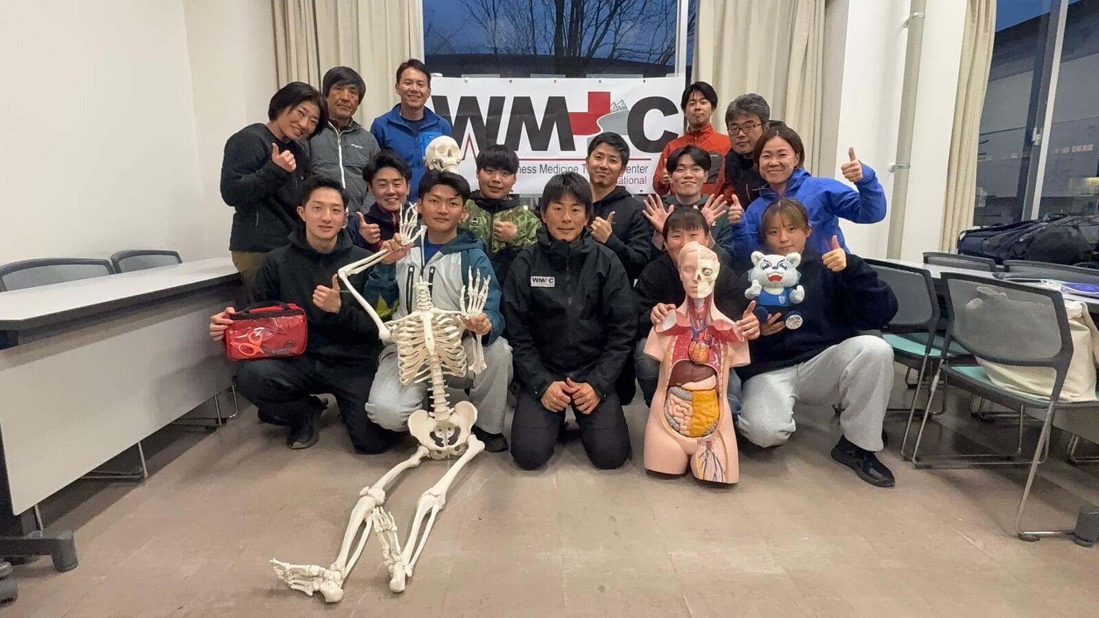 Graduates posing with instructor after completing a WMTC course.