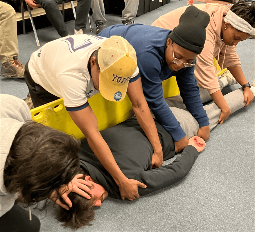 Students practicing a BLS roll in a WMTC course.