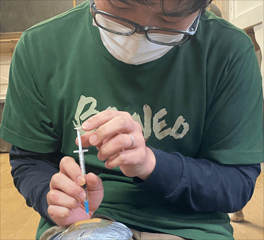 Student practicing an injection during a lab in a WMTC course.